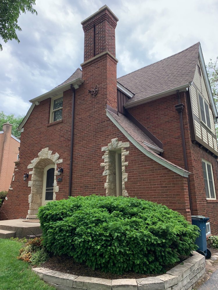 Tudor-style Chicago home with a fully rebuilt, tuckpointed red-brick chimney