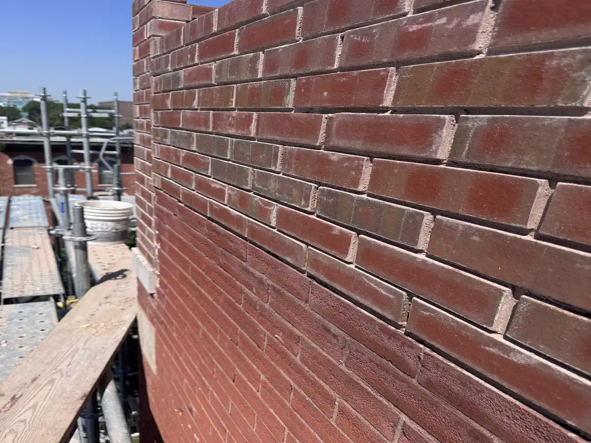 Close-up of color-matched mortar joints on freshly repointed Chicago brick wall